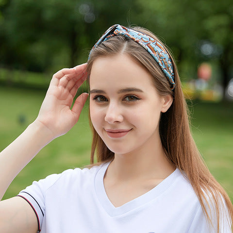 Orange geometric patterned 100% silk headband on a woman-19