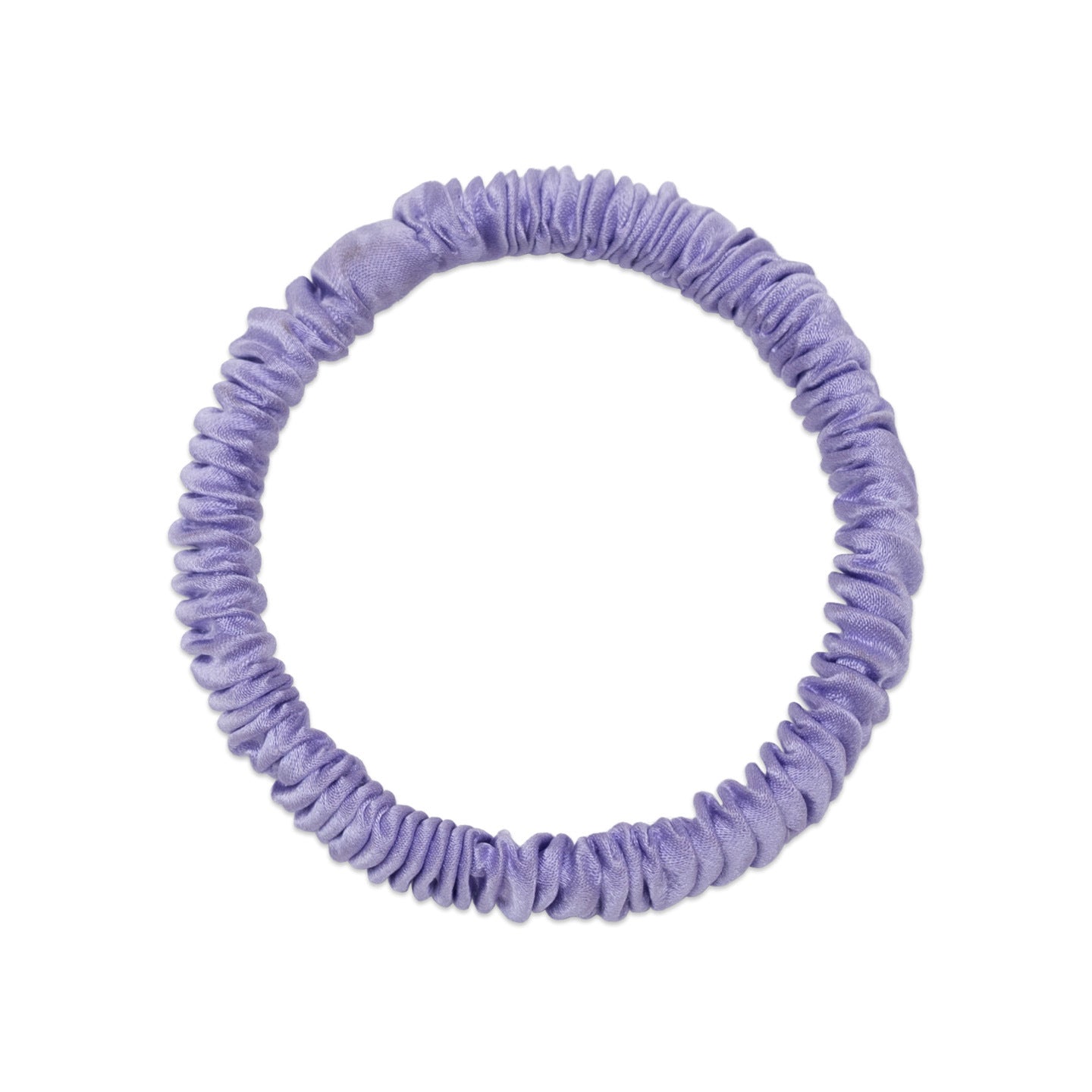 A woman wearing colorful 100% silk scrunchies in her hair and on her wrist-11