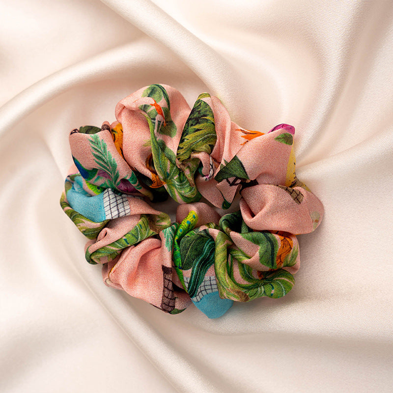 A collection of colorful 100% silk scrunchies-15