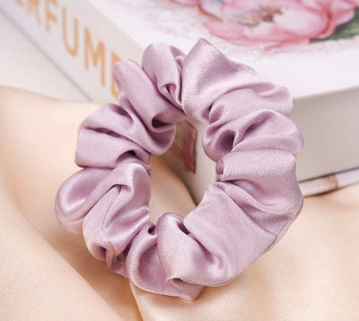 A lilac 100% silk scrunchie