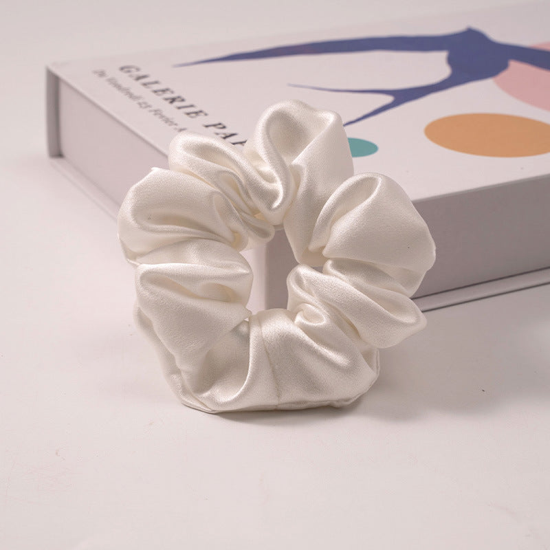 A set of silk scrunchies in various colors including beige, blue, brown, and more-22