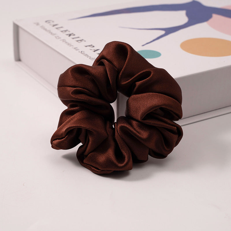 A set of silk scrunchies in various colors including beige, blue, brown, and more-28