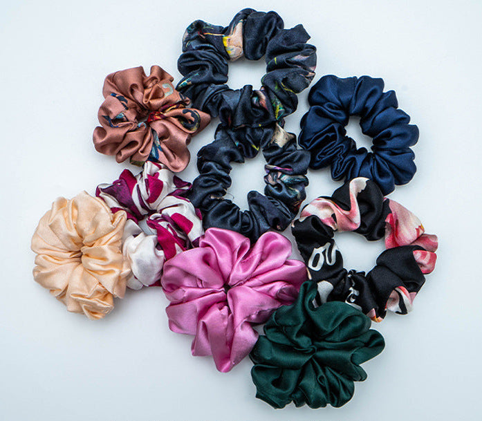 A collection of colorful 100% silk scrunchies