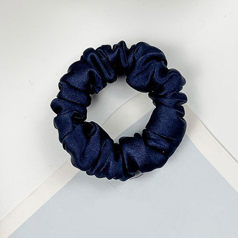 A collection of colorful 100% silk scrunchies-17