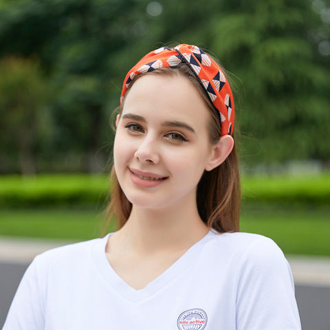 Orange geometric patterned 100% silk headband on a woman-21