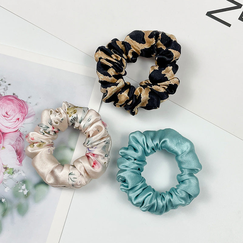 A collection of colorful 100% silk scrunchies-3