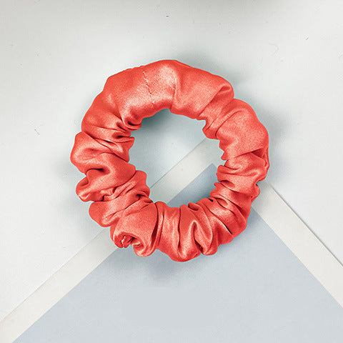 A collection of colorful 100% silk scrunchies-19