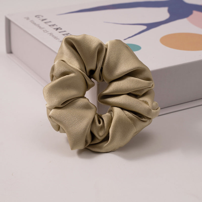 A set of silk scrunchies in various colors including beige, blue, brown, and more-23