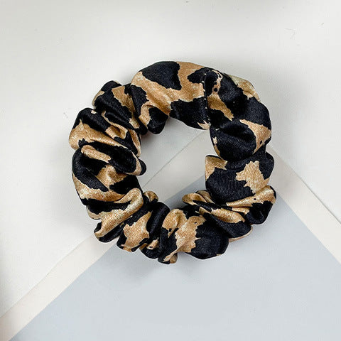 A collection of colorful 100% silk scrunchies-23