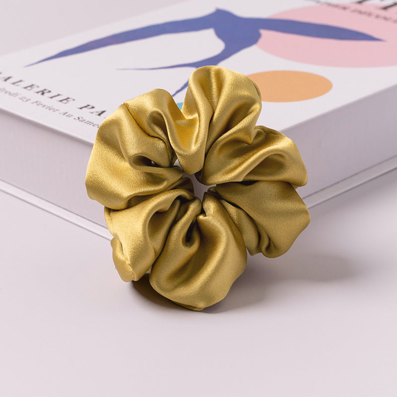 A set of silk scrunchies in various colors including beige, blue, brown, and more-30
