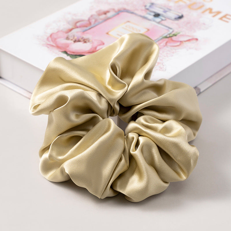 A set of silk scrunchies in various colors including beige, blue, brown, and more-49