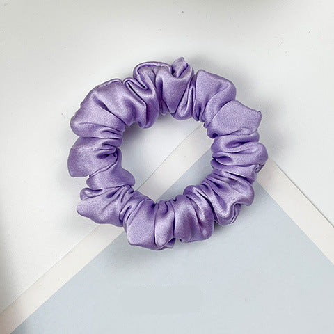 A collection of colorful 100% silk scrunchies-16