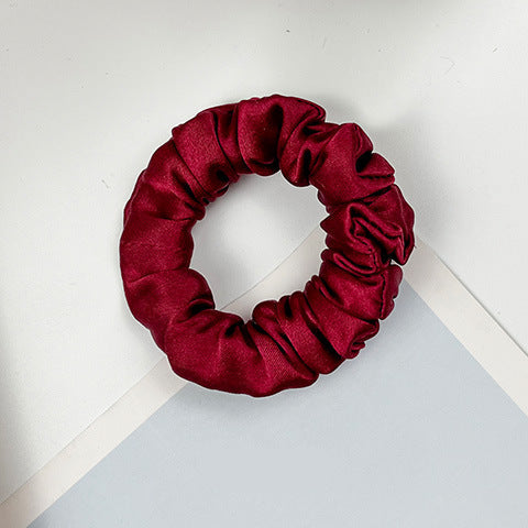 A collection of colorful 100% silk scrunchies-11