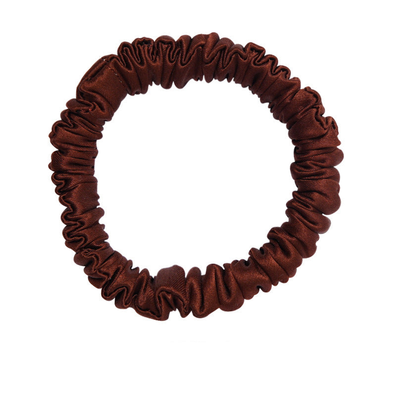 A set of silk scrunchies in black, gray, beige, brown, light blue, pink, and green colors-16