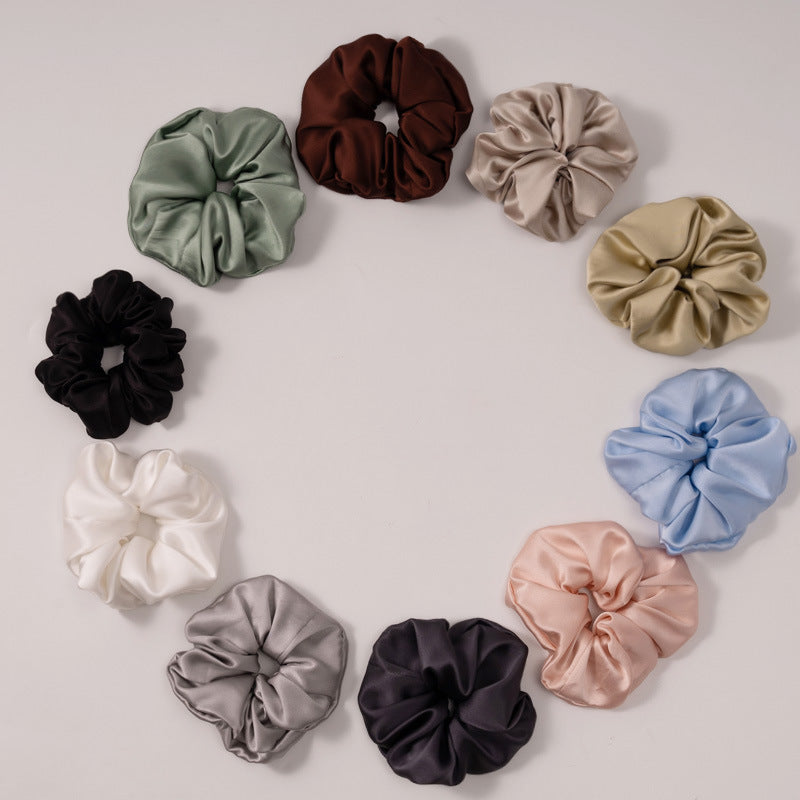 A collection of silk scrunchies in various colors-2