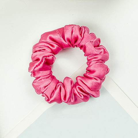 A collection of colorful 100% silk scrunchies-8