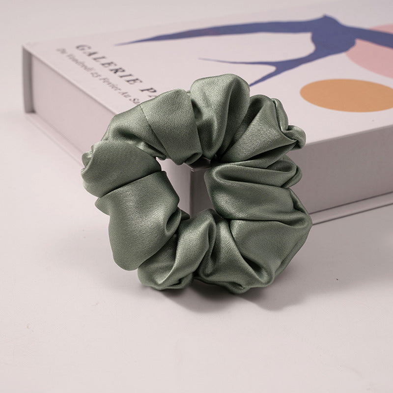 A set of silk scrunchies in various colors including beige, blue, brown, and more-19