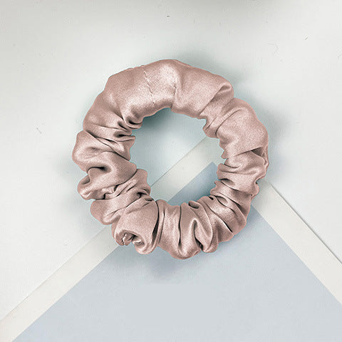 A collection of colorful 100% silk scrunchies-12