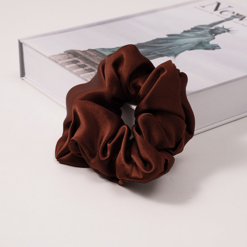 A set of silk scrunchies in various colors including beige, blue, brown, and more-41