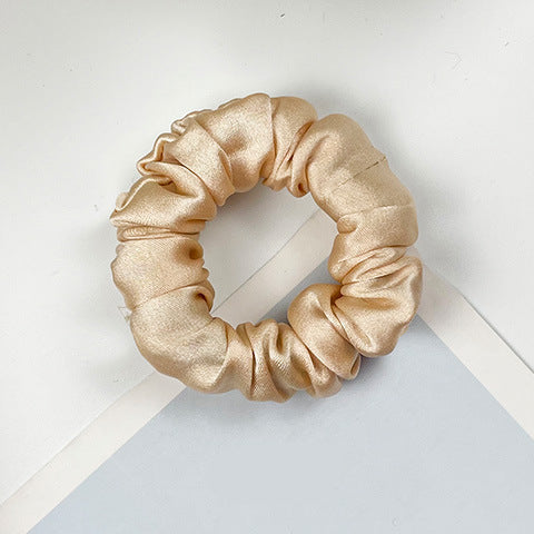 A collection of colorful 100% silk scrunchies-14