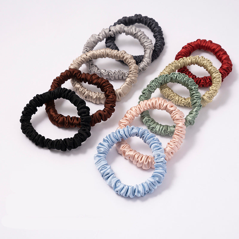A set of silk scrunchies in black, gray, beige, brown, light blue, pink, and green colors-2