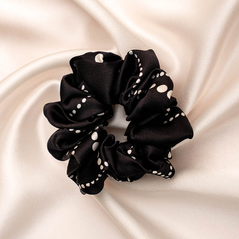 A collection of colorful 100% silk scrunchies-10