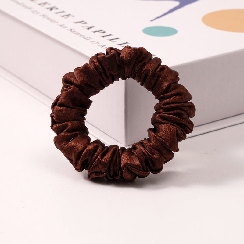 A set of silk scrunchies in black, brown, white, pink, green, and gray colors-15