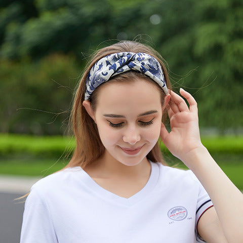 Orange geometric patterned 100% silk headband on a woman-15