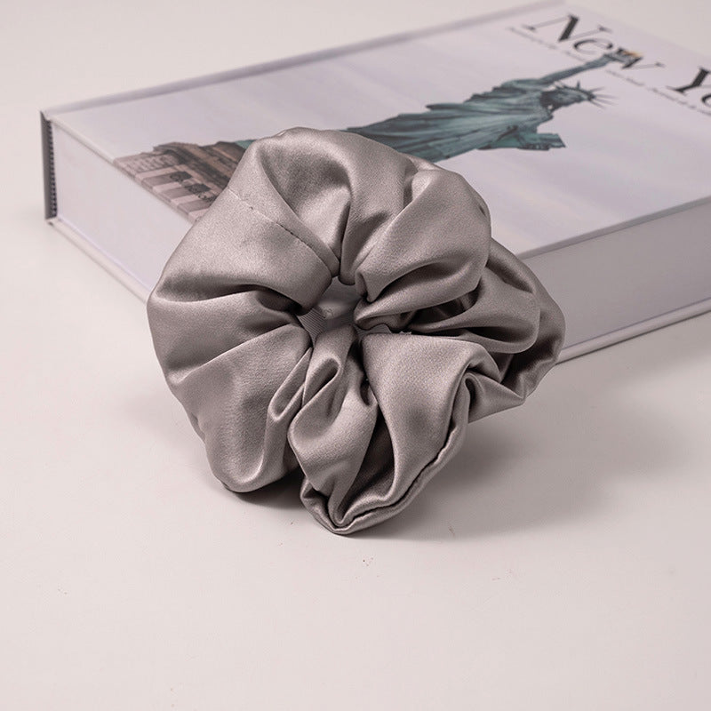A set of silk scrunchies in various colors including beige, blue, brown, and more-33