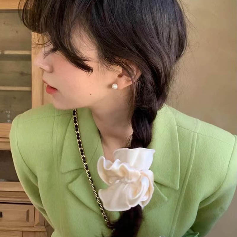 A light - colored 100% silk double - layered large bow scrunchie