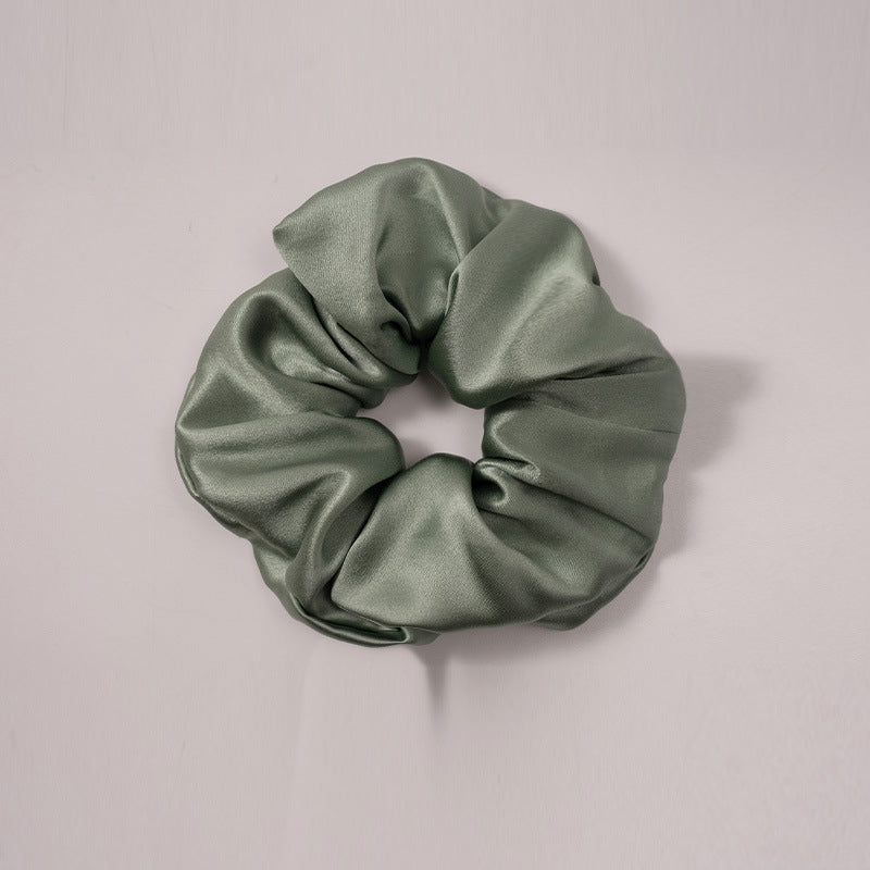 A set of silk scrunchies in various colors including beige, blue, brown, and more-4
