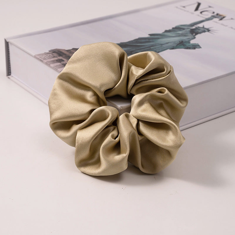 A set of silk scrunchies in various colors including beige, blue, brown, and more-36