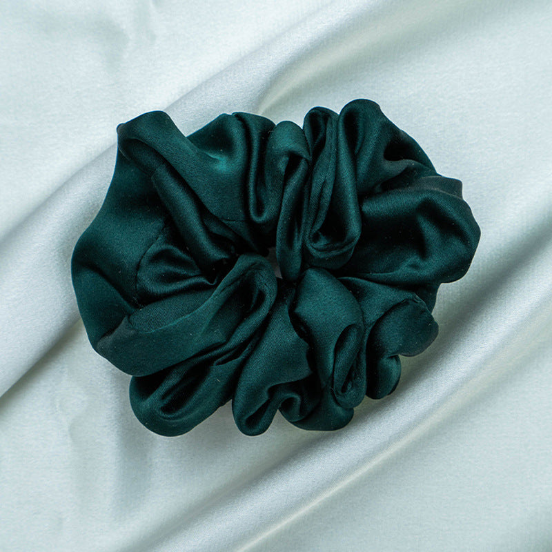 A collection of colorful 100% silk scrunchies-16