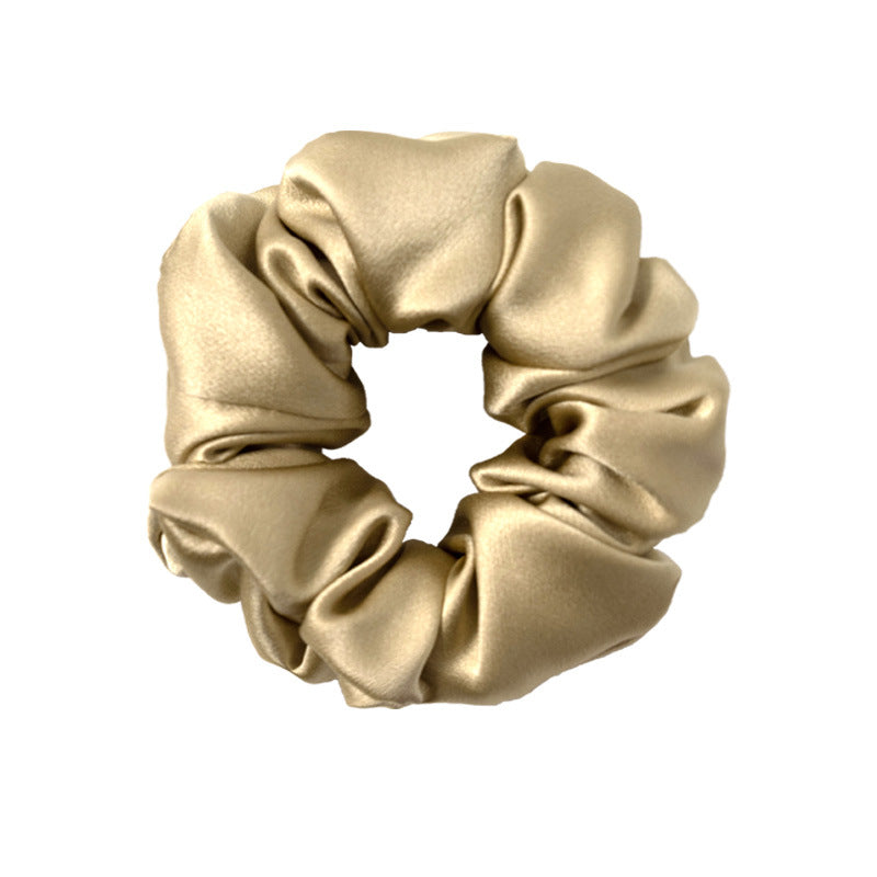 A collection of silk scrunchies in various colors-5