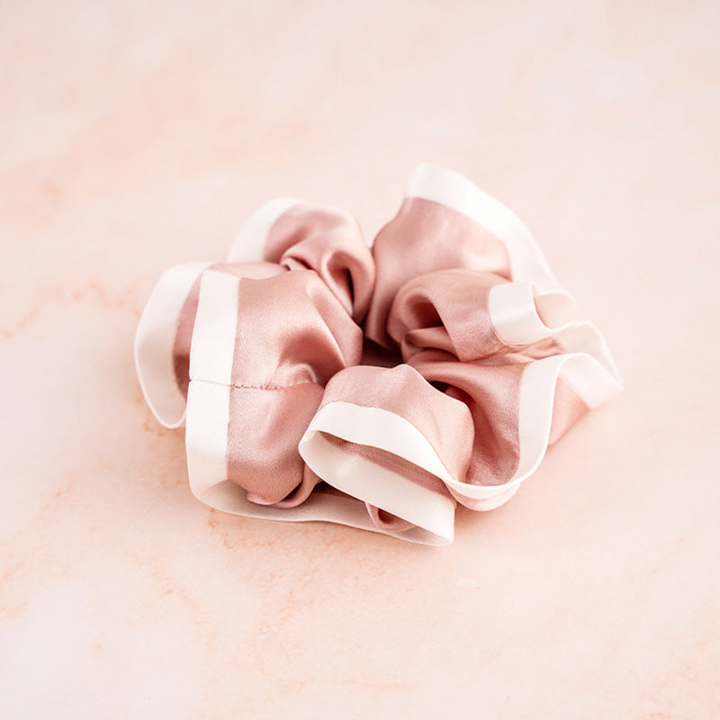 A set of colorful 100% silk scrunchies in beige, black, blue, green, and pink-10
