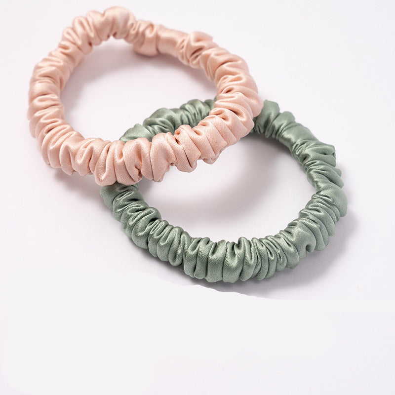 A set of silk scrunchies in black, gray, beige, brown, light blue, pink, and green colors-4
