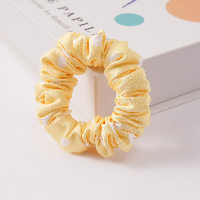 A set of silk scrunchies in black, brown, white, pink, green, and gray colors-24
