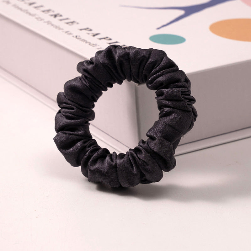 A set of silk scrunchies in various colors including beige, blue, brown, and more-14