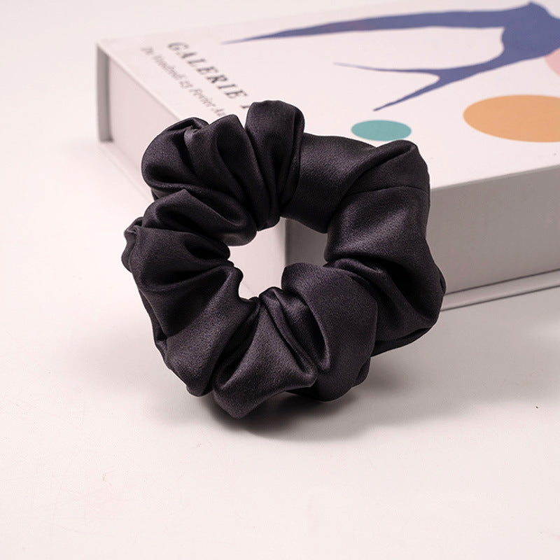 A set of silk scrunchies in various colors including beige, blue, brown, and more-27