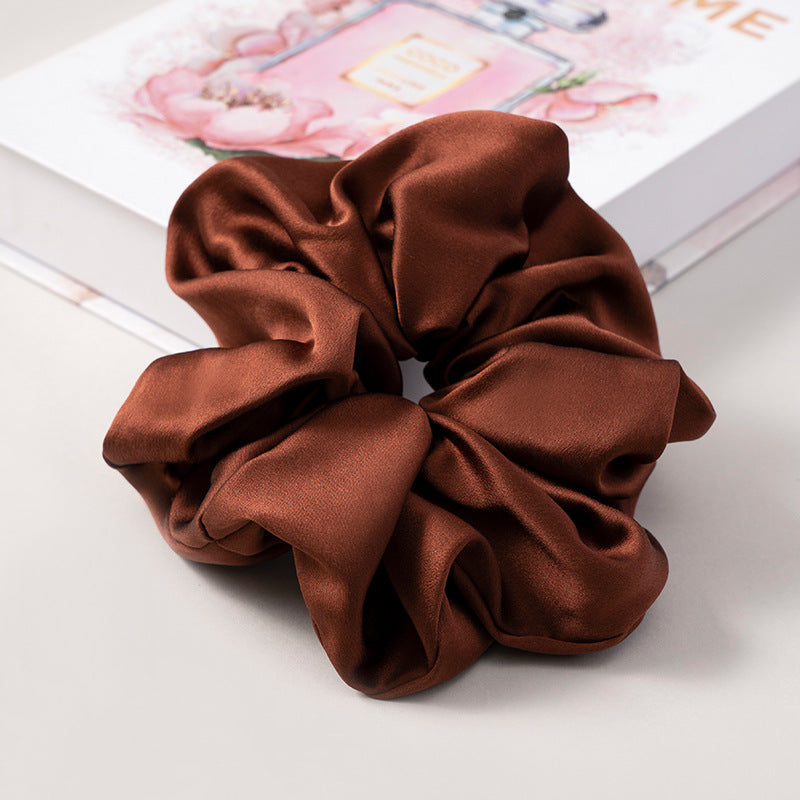A set of silk scrunchies in various colors including beige, blue, brown, and more-54