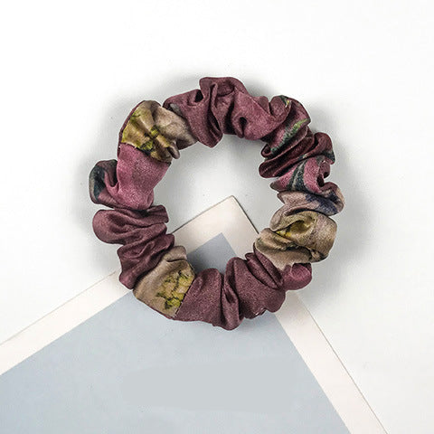 A collection of colorful 100% silk scrunchies-25