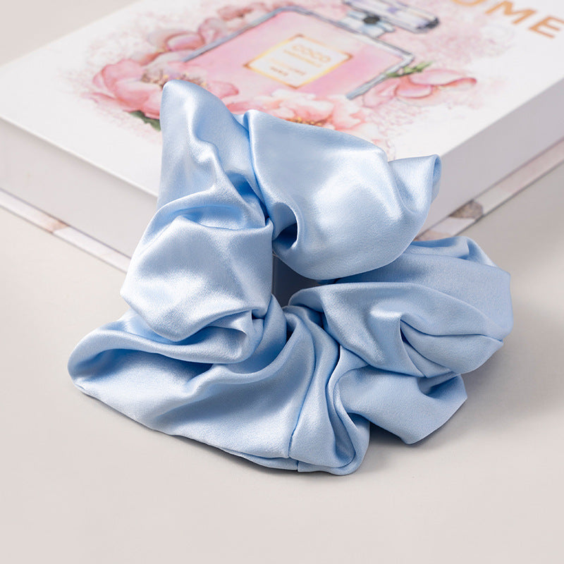 A set of silk scrunchies in various colors including beige, blue, brown, and more-51