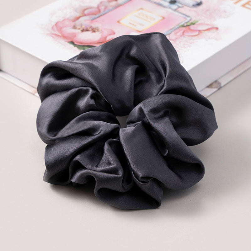 A set of silk scrunchies in various colors including beige, blue, brown, and more-53