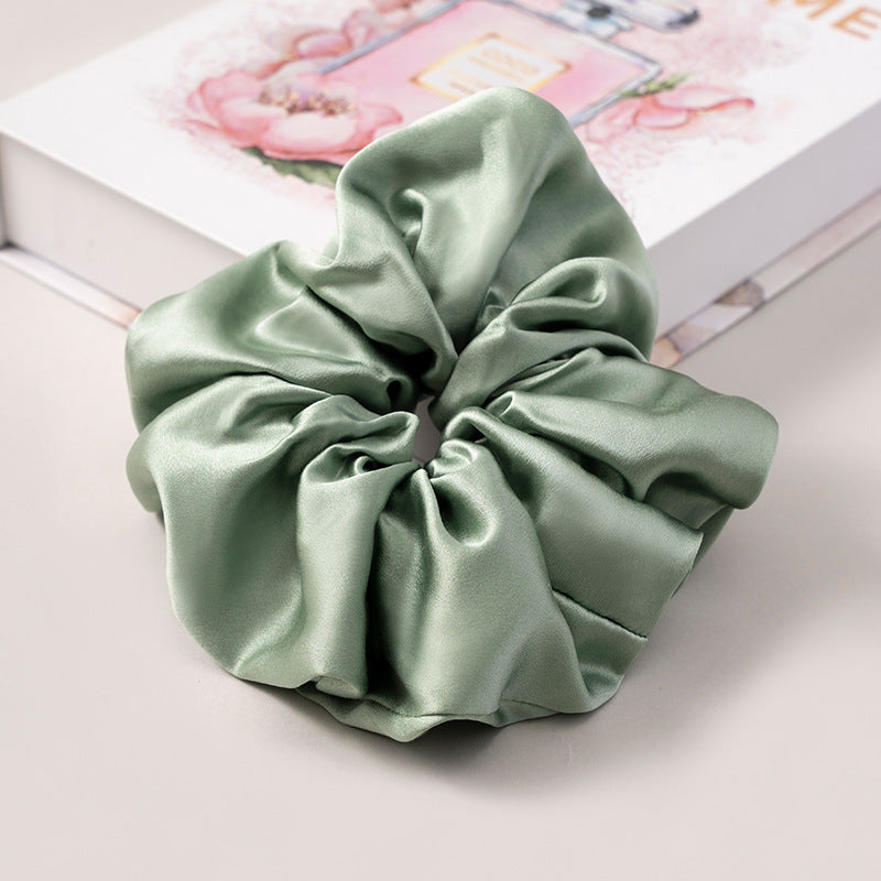 A set of silk scrunchies in various colors including beige, blue, brown, and more-45