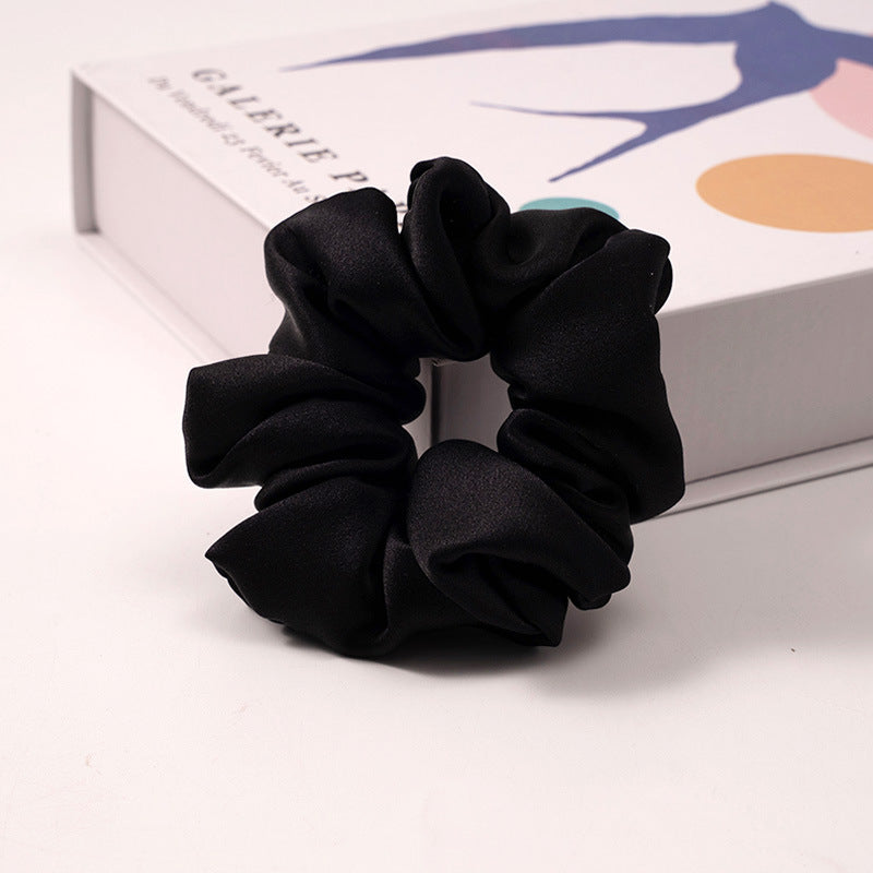 A set of silk scrunchies in various colors including beige, blue, brown, and more-21