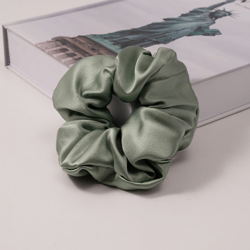 A set of silk scrunchies in various colors including beige, blue, brown, and more-32