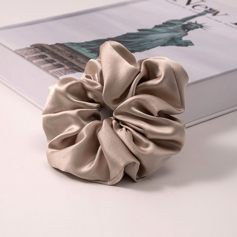 A set of silk scrunchies in various colors including beige, blue, brown, and more-37