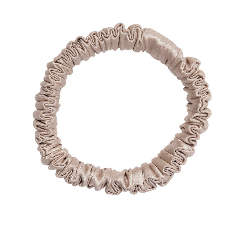 A set of silk scrunchies in black, gray, beige, brown, light blue, pink, and green colors-11