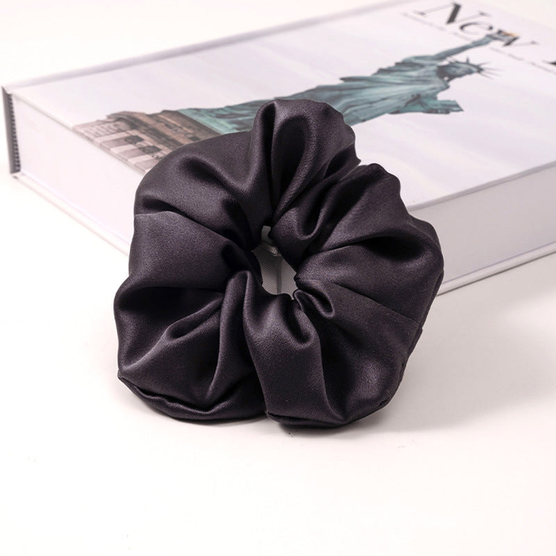 A set of silk scrunchies in various colors including beige, blue, brown, and more-40