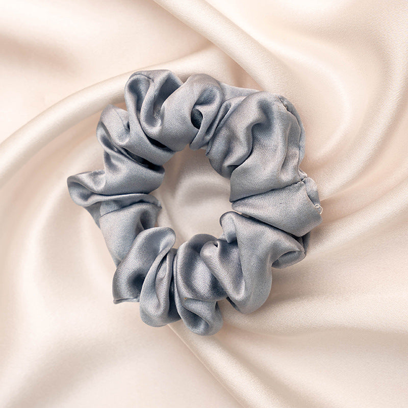 A collection of colorful 100% silk scrunchies-24